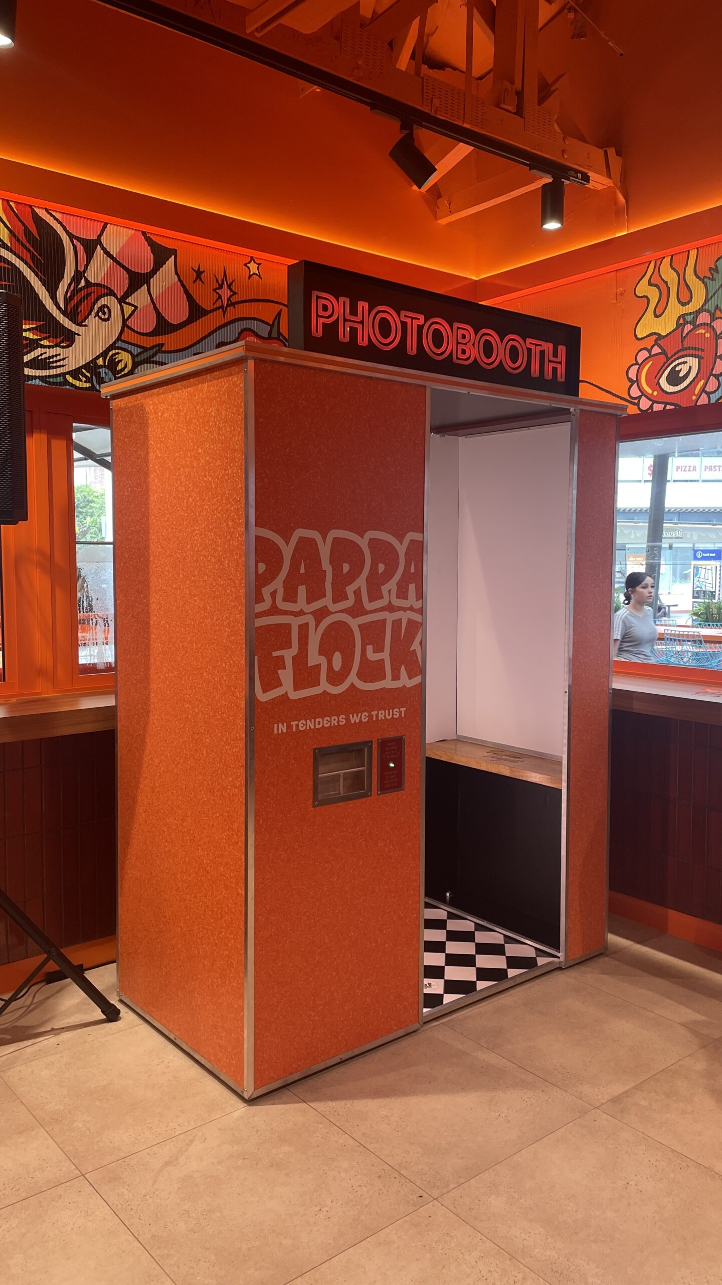 Enclosed Booth Hire Gold Coast wrapped in vibrant branding